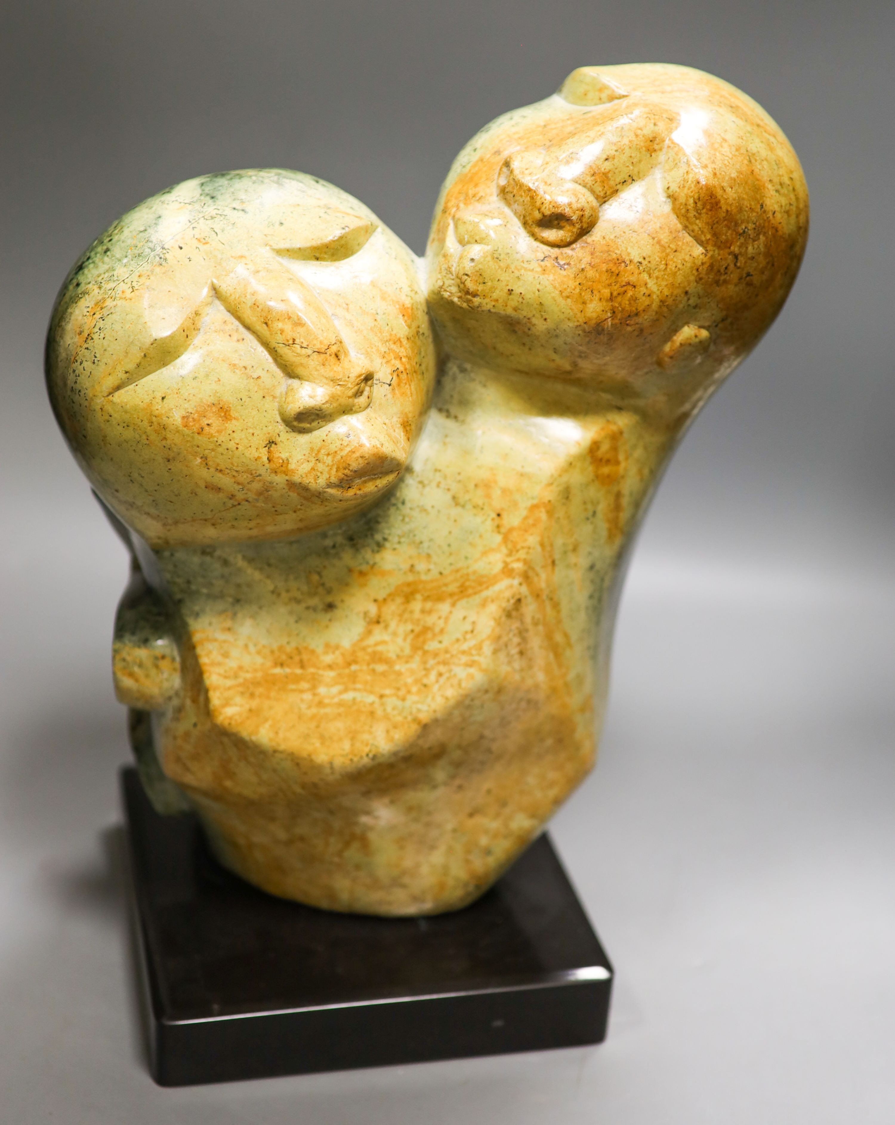 South African soapstone figural carving, mother and child 38cm